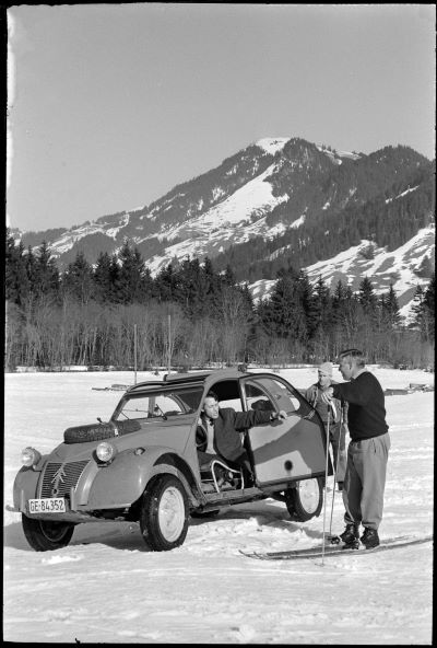 1961 2CV 4x4 on a slope near Berne next to a skier