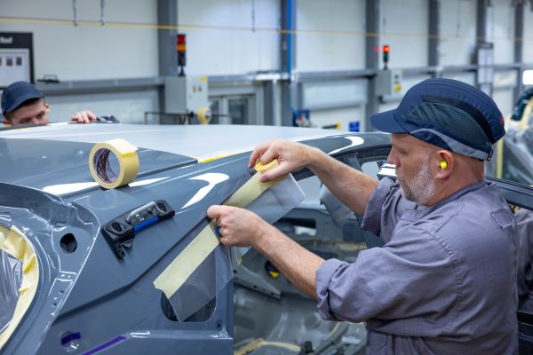 Operator applying masking tape to a Qashqai at Nissan Sunderland